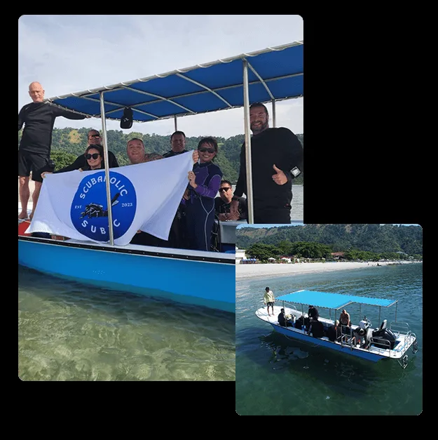 Groupe de plongeurs souriants sur un bateau bleu avec une bannière