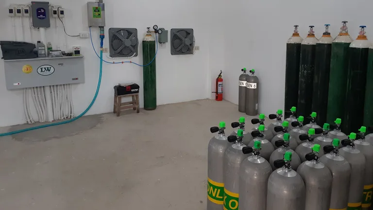 Bouteilles de plongée alignées dans une salle claire et fonctionnelle