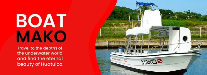 Bateau de plongée blanc amarré à quai avec texte promotionnel rouge