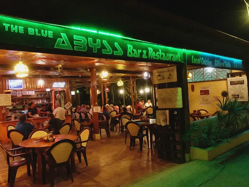Bar restaurant The Blue Abyss avec clients assis aux tables éclairées