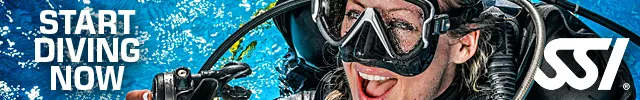 Plongeuse souriante avec masque et détendeur, promotion plongée SSI