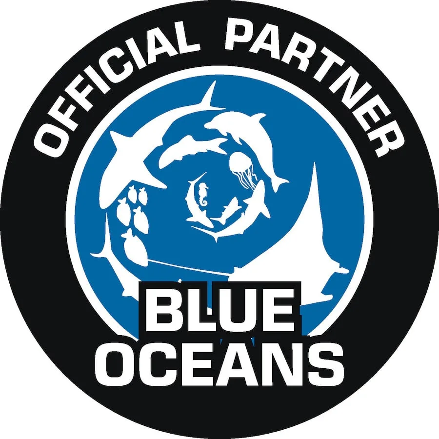Logo circulaire bleu et blanc avec des dauphins et une pieuvre