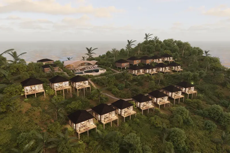 Vue aérienne d'un complexe hôtelier tropical avec des bungalows et piscine