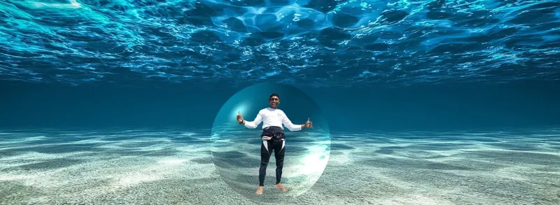 Plongeur debout sur le fond marin, entouré d'une bulle d'air