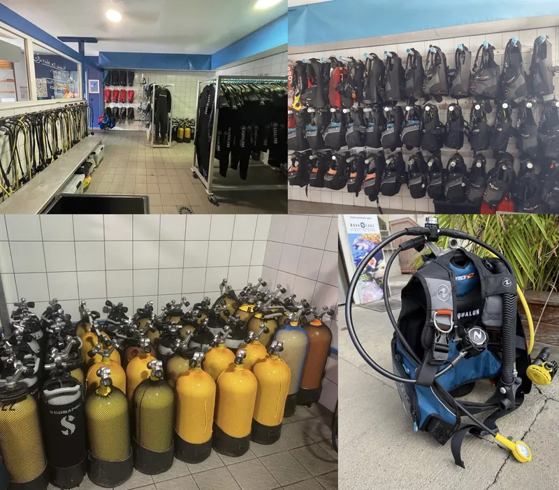 Intérieur d'un centre de plongée avec combinaisons, gilets et bouteilles
