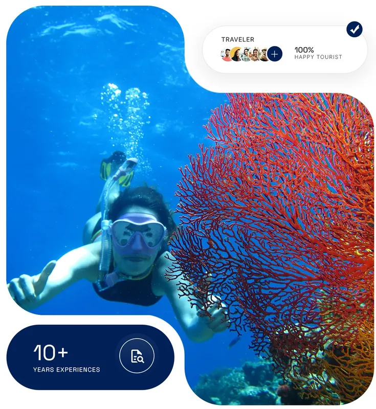 Plongeuse souriante nageant près d'un corail rouge vif en mer