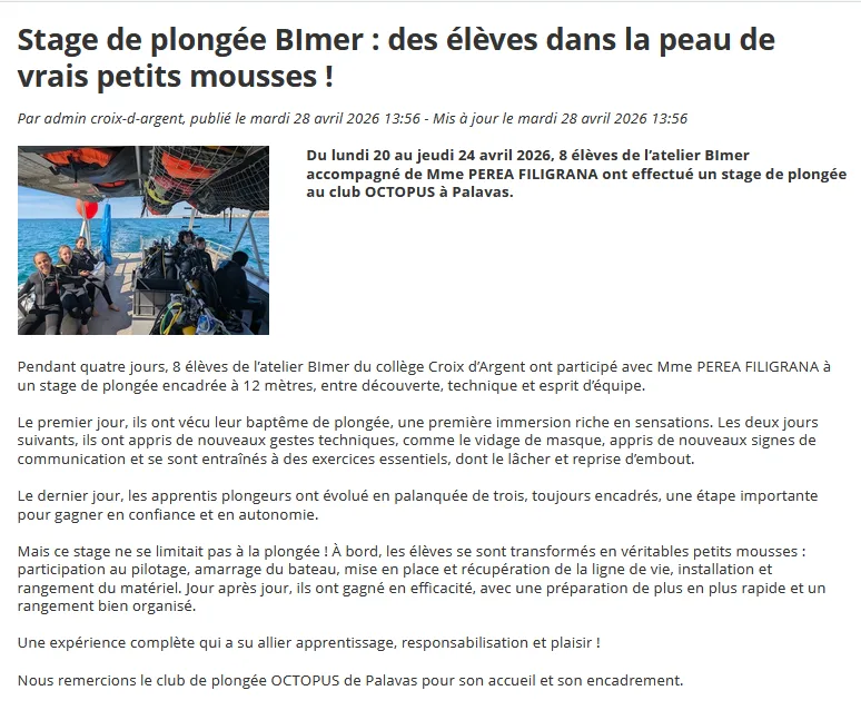 Groupe d'élèves en combinaison de plongée, souriants, lors d'un stage