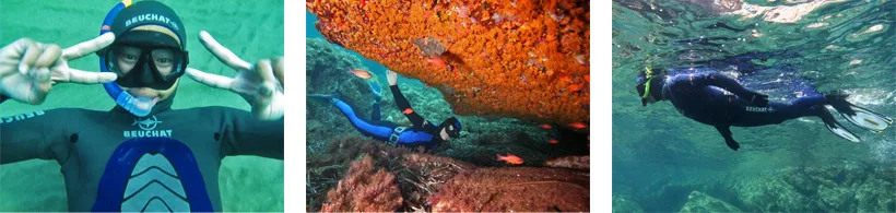 Plongeur en combinaison effectuant des signes sous l'eau, lumière verte