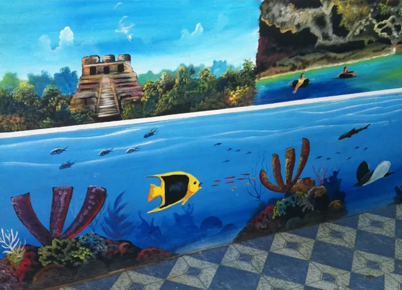 Fresque murale marine avec poissons, ruines et kayakistes