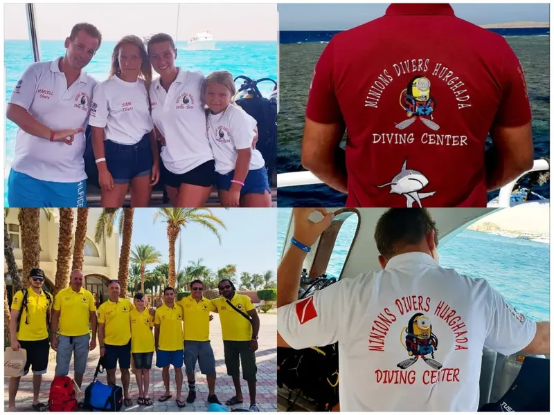 Equipe de plongee souriante devant un bateau et un bâtiment