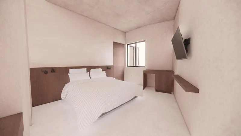 Une chambre lumineuse avec un lit et une télévision murale.