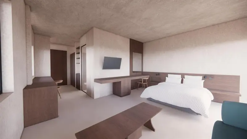 Une chambre lumineuse avec un lit et un espace détente.