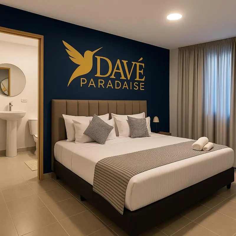 Une chambre avec un grand lit et une décoration sobre.
