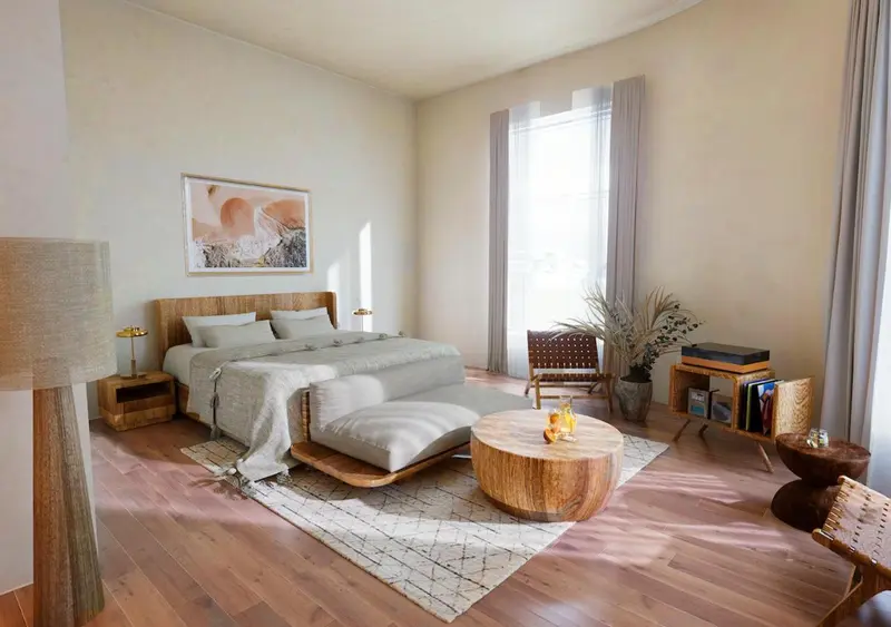Une chambre lumineuse avec un grand lit et une décoration naturelle.
