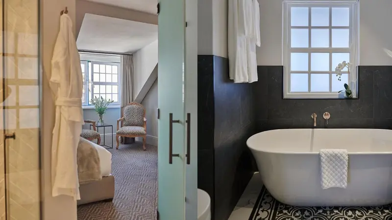 Une salle de bain moderne avec une baignoire et une chambre attenante.