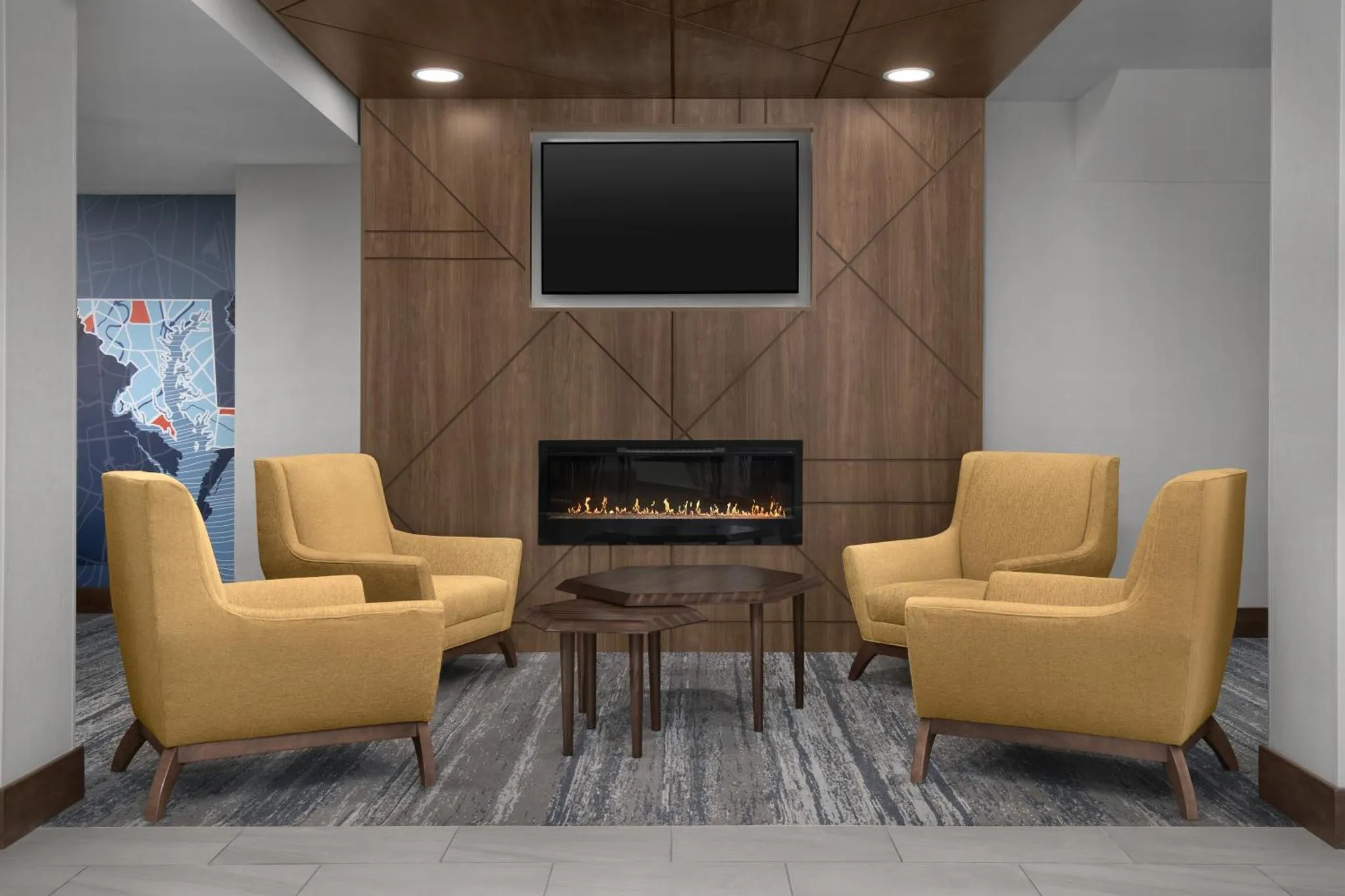 Un espace de détente avec deux fauteuils et une cheminée décorative.