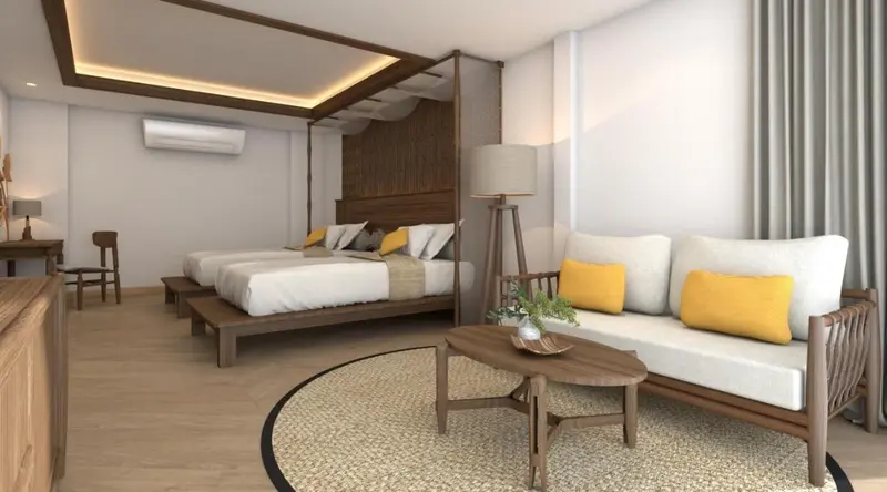 Une chambre lumineuse avec deux lits et un canapé.