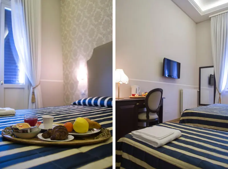 Une chambre d'hôtel avec un petit-déjeuner servi sur un plateau.