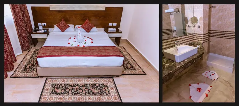 Une chambre d'hôtel avec un lit double décoré de fleurs et un tapis.