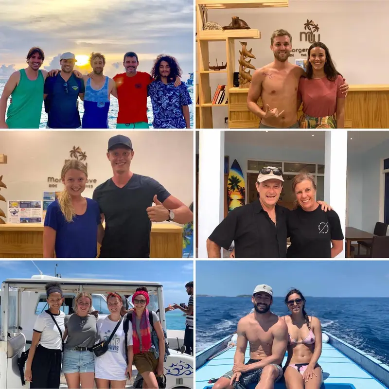 Groupe de personnes souriantes posant devant un comptoir et un bateau.