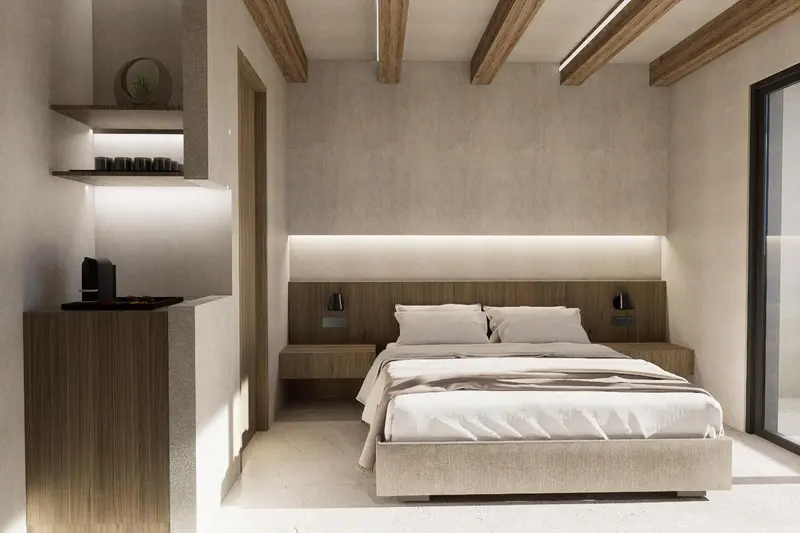 Une chambre lumineuse avec un grand lit et un éclairage indirect.