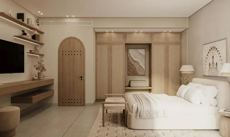 Une chambre lumineuse avec un lit confortable et un meuble bas.