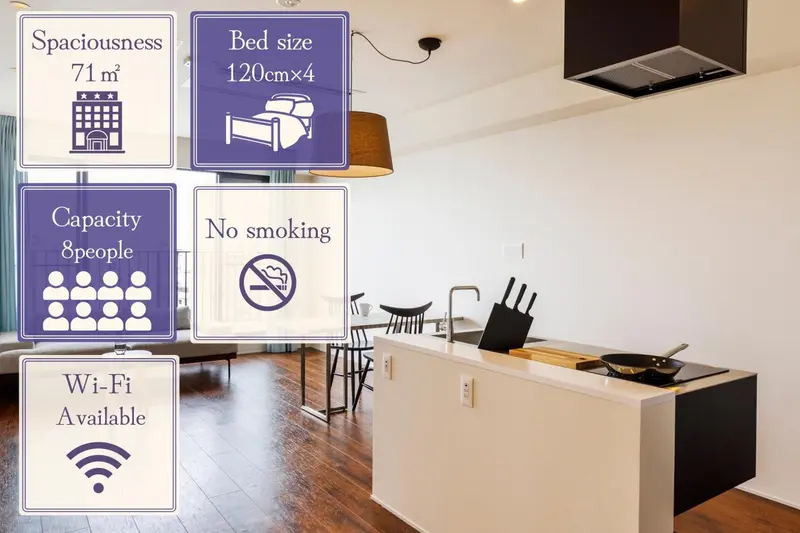 Une chambre lumineuse avec un lit double et un espace repas.