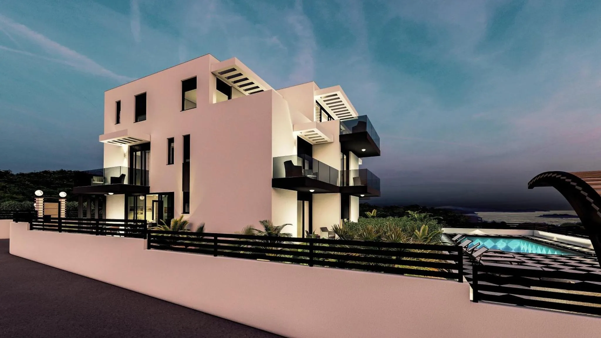 Bâtiment moderne avec des balcons et une vue sur la mer au crépuscule.
