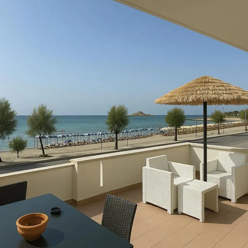 Terrasse aménagée avec mobilier de jardin donnant sur une plage de sable fin et la mer.