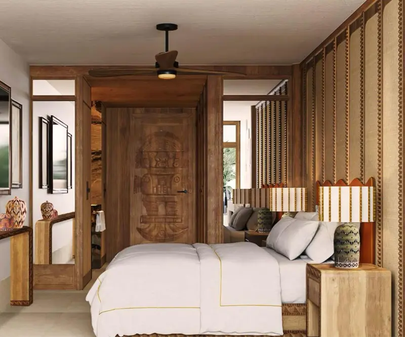 Une chambre lumineuse avec un lit recouvert d'un couvre-lit blanc.
