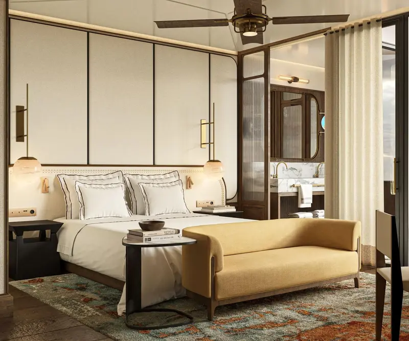 Une chambre lumineuse avec un lit confortable et un coin salon.