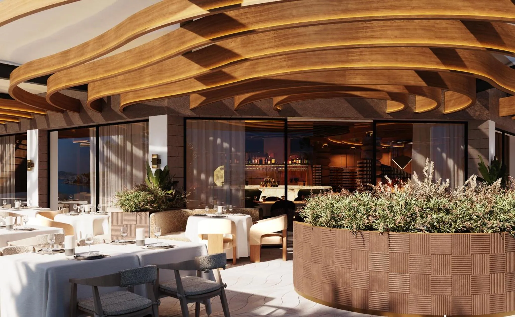 Une salle à manger lumineuse avec des tables dressées et une vue sur la mer.