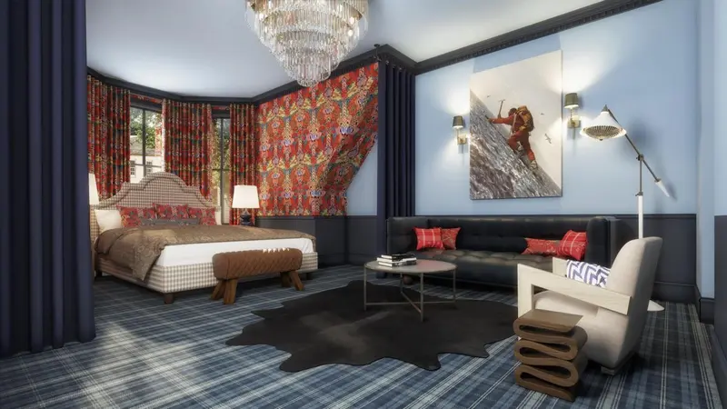 Une chambre élégante avec un grand lit et un coin salon.