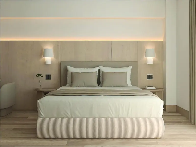 Une chambre moderne avec un grand lit et un éclairage doux.