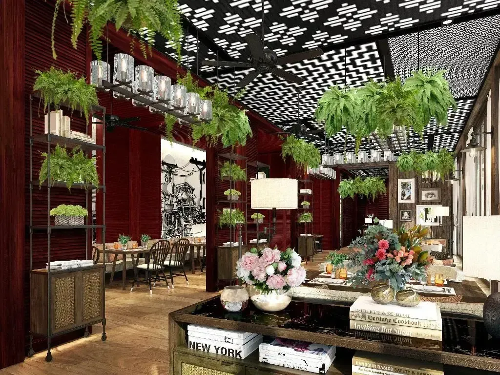 Espace intérieur décoré de plantes suspendues et de livres.