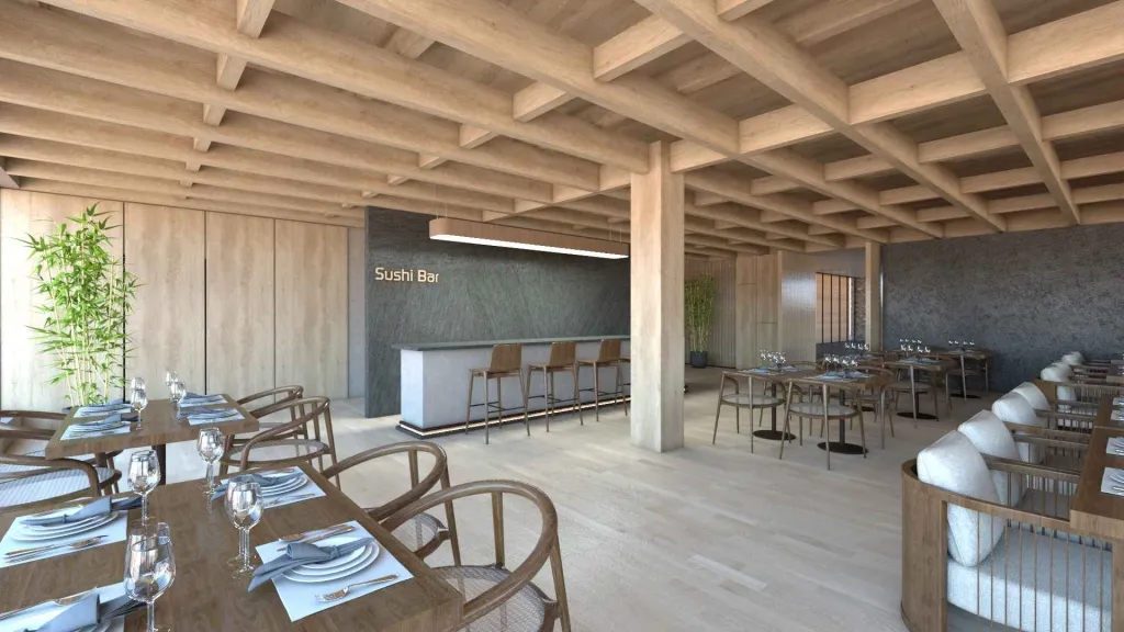 Une salle de restaurant lumineuse avec des tables dressées et un comptoir de bar.