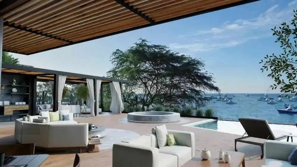 Espace de détente extérieur avec mobilier confortable et vue sur la mer.