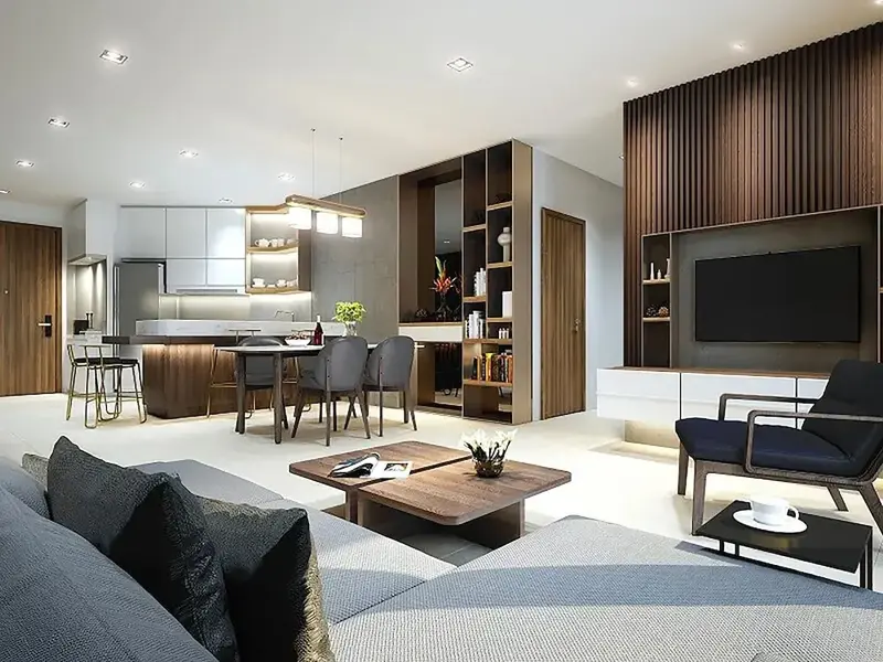 Espace de vie lumineux avec coin repas et cuisine ouverte.