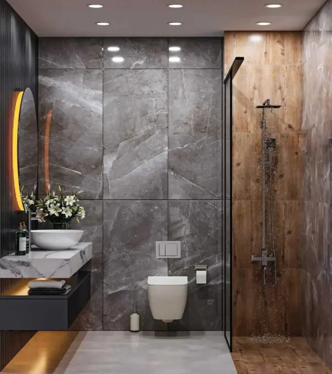 Une salle de bain moderne avec douche à l'italienne et lavabo sur meuble.