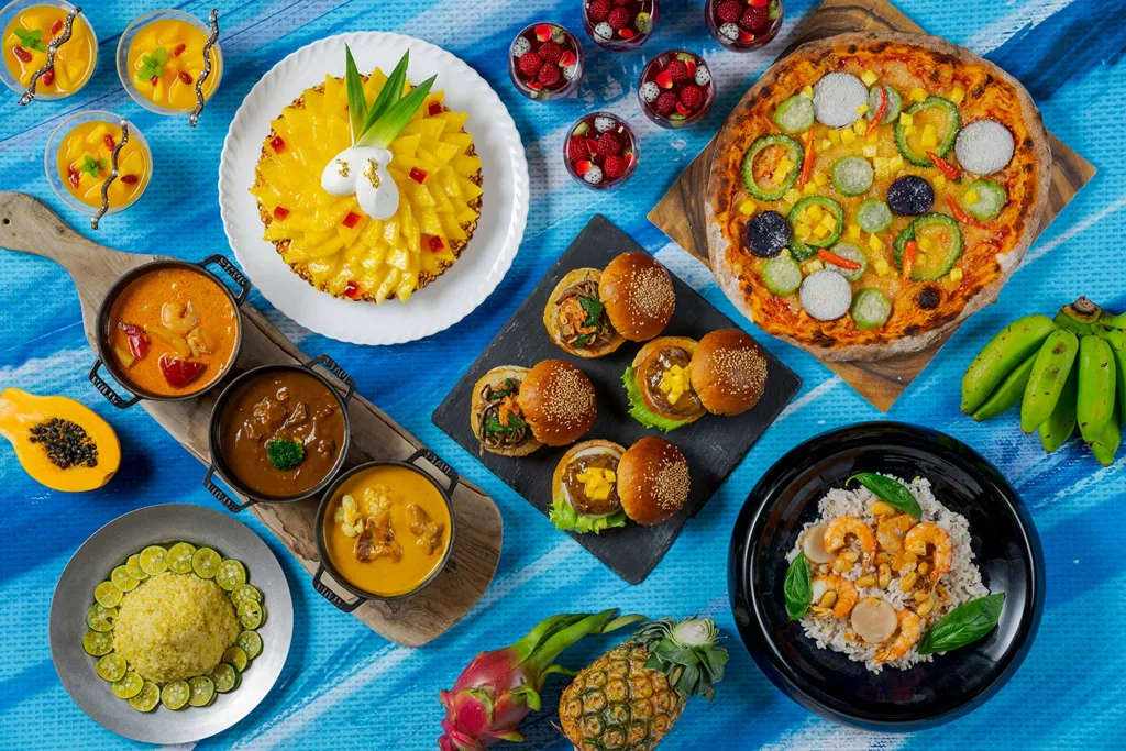 Assortiment de plats colorés et variés présentés sur une table.