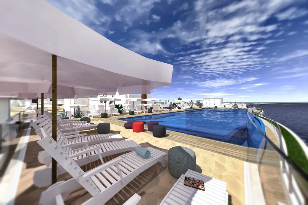 Transats blancs disposés autour d'une piscine à débordement avec vue sur la mer.