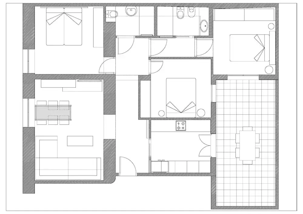 Plan d'un appartement avec plusieurs pièces et une terrasse.
