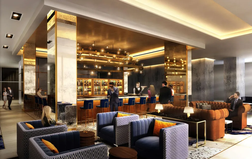 Un bar moderne avec un comptoir illuminé et des clients assis sur des tabourets.